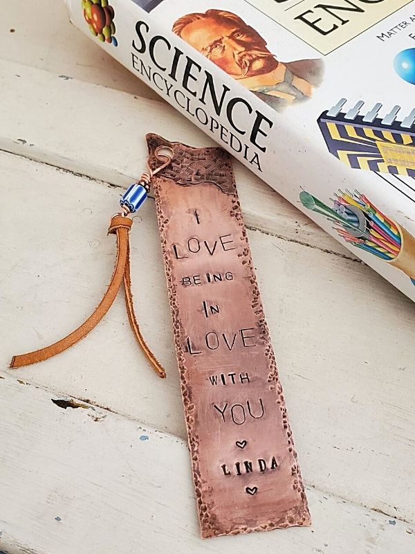 copper bookmark with science book