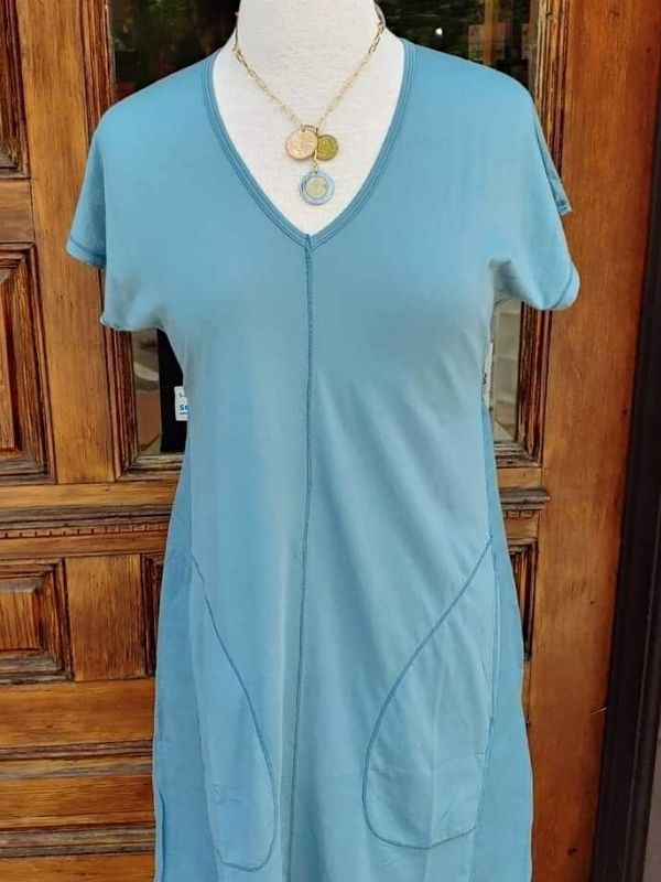 coin necklace in mannequin with blue dress
