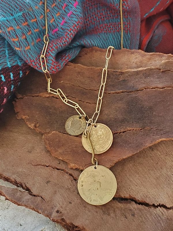 coin cluster necklace on wood with scarf