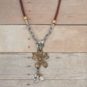 brown leather wildflower necklace on wood