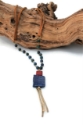 Lapis-pendant-necklace-with-brass-sticks-wire-wrapped-beads-with-leather-cord-on-wood-white-background