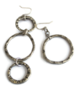 silver-patterened-asymmetrical-hoop-earrings-on-white-background