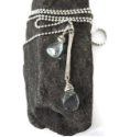 Sterling  aquamarine necklace on rock