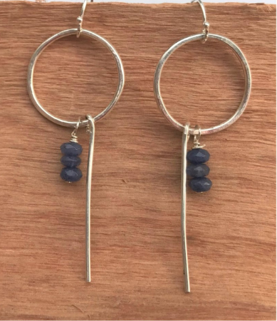 sterling hoop blue stone earrings on wood