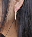 gold earrings on girls ear
