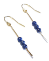 blue stone gold stick earrings on white