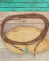 brown suede turquoise wrap necklace on wood