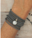 white pearl gray suede wrap bracelet on arm