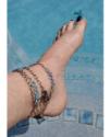 crystal chain anklets on foot in water