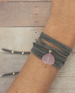 gray suede wrap bracelet with pink stone on arm