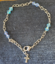 cross anklet with crystal and chain on denim