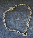 yellow crystal silver chain anklet on denim