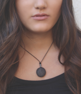 black lava leather necklace on dark haired model