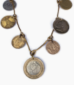 mixed metal coin statement necklace on white