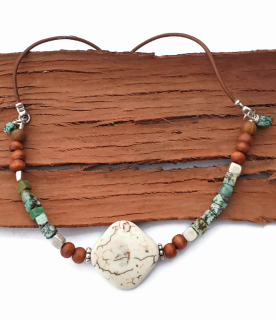 white wood turquoise leather necklace on wood