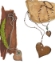 3 copper heart necklaces on wood and stone