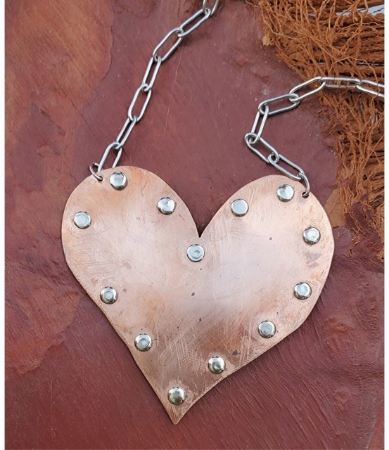 copper heart statement necklace with rivets and silver chain