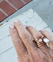 Wearing White freshwater pearl copper cuff & copper coil ring stack