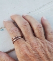 two bronze cuff rings worn on pointer finger