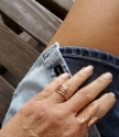 Wearing hammered copper wrap ring with denim