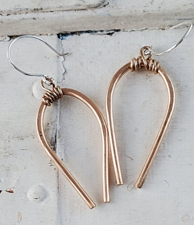 Casual Bronze Horseshoe earrings on white distressed trunk