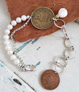 Artisan Old coin bracelet with pearls and chain on wood