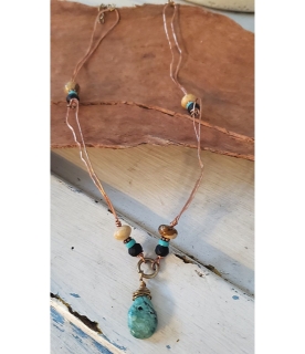 Turquoise black tan gemstone copper loop necklace on wood