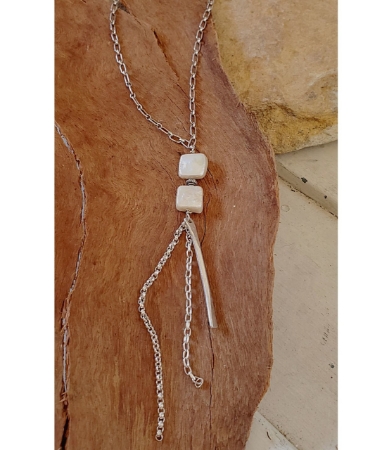 Pearl long silver chain necklace on wood