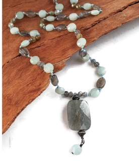 Casual blue gray gemstone necklace on wood