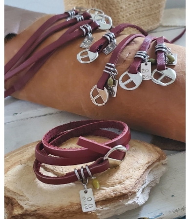 Matching family leather wrap bracelets on leather & rock display