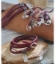 Matching family leather wrap bracelets on leather & rock display