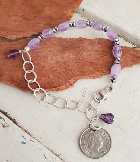 Purple stone on a Netherland coin bracelet