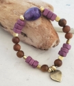 Purple gemstone aromatherapy heart bracelet on wood log