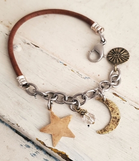 moon star crystal leather chain bracelet on white trunk