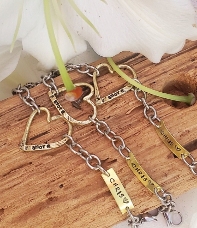 3 heart name tag remembrance bracelets with white flower on wood