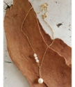 gold chain white pearl drop necklace -full length on wood