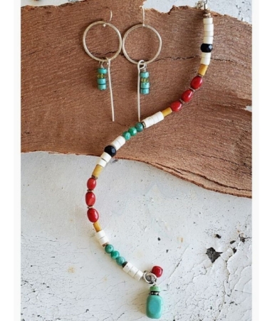 cheerful gemstone color bracelet and hoop earrings on wood