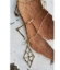 crystal chain. brass bars, Diamond paw print necklace on wood