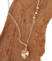 crystal heart gold pearl silver chain necklace on wood