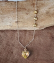Gold pearls Swarovski crystal heart silver chain necklace on wood