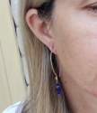 Blue gemstone bronze hoop earring on female