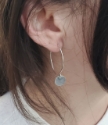 Silver hoop drop disc earrings on female 