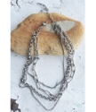 modern silver mixed chain necklace on rock
