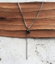 black onyx gemstone silver box chain Y necklace on wood