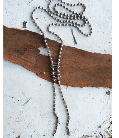 silver bead ball chain long ladder necklace on wood