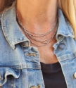 dainty silver tube chain layered necklace on model