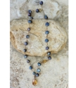 Yellow gemstone pendant blue freshwater pearl necklace on stones full view