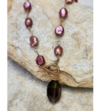 Handcrafted pink-brown pearl brown gemstone toggle necklace on stones