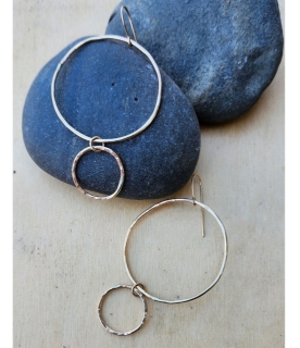 handcrafted in gold double hoop hammered earrings on black rocks