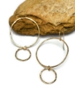 hammered gold big hoop, little hoop earrings on rock